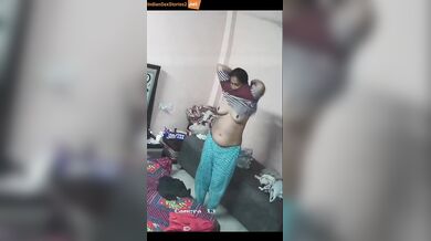 Desi busty Bhabhi dress change caught in cctv