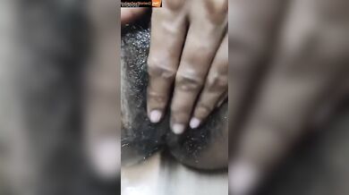 Sexy south Indian bhabhi massaging her hairy pussy