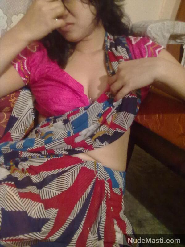 shy indian housewife with blouse buttons open